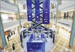  ??  ?? A promotiona­l event for platinum jewelry gets under way in a shopping mall in Huizhou, Guangdong province, in November 2019.