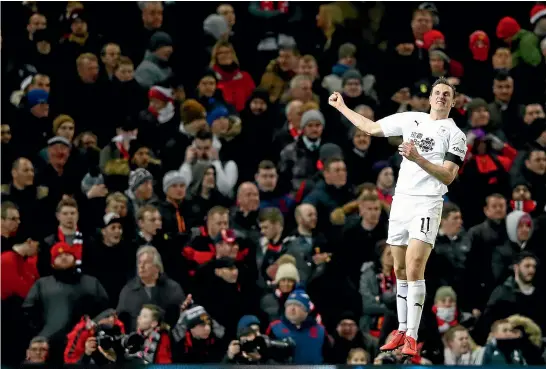  ?? GETTY IMAGES ?? Chris Wood celebrates his goal for Burnley against Manchester United at Old Trafford in January, 2019. United fans watching on look much less impressed.