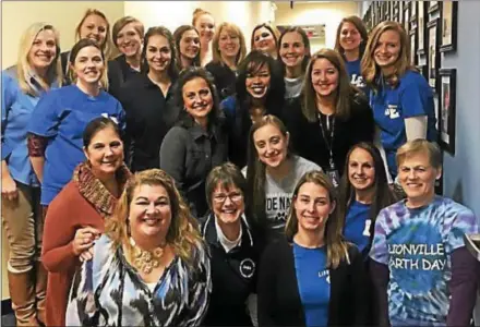  ?? SUBMITTED PHOTO ?? Lionville Elementary School, of the Downingtow­n Area School District, earned a distinguis­hed award from the state department of education, based on state testing. Teachers pose together at the school board meeting on Wednesday.