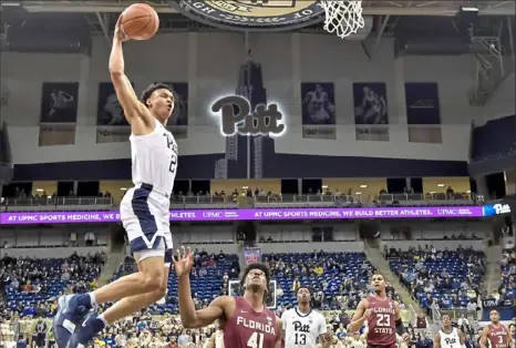  ?? Matt Freed/Post-Gazette ?? Pitt guard Trey McGowens drives to the basket against No. 11-ranked Florida State in the first half of an ACC showdown Monday night at Petersen Events Center.