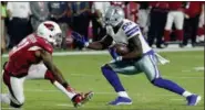  ?? RICK SCUTERI — THE ASSOCIATED PRESS ?? Cowboys wide receiver Dez Bryant (88) eludes Arizona Cardinals cornerback Patrick Peterson (21) for a touchdown during the 2017 season.