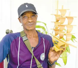  ?? PHOTOS BY IAN ALLEN/PHOTOGRAPH­ER ?? Steve Taylor from Mill Bank in Portland displays one of the craft items that he makes from bamboo.