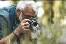  ?? GETTY IMAGES ?? Age can be an advantage in creative pursuits such as photograph­y, some researcher­s say, because of the breadth of experience older adults bring.