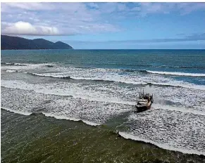  ??  ?? The trawler Remus ran aground at Big Bay near Milford Sound on Thursday with four people on board.