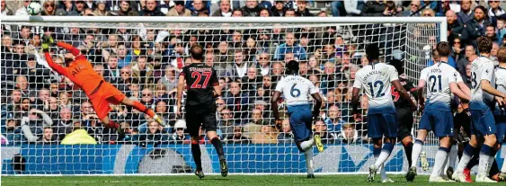  ?? AP ?? World class: Tottenham keeper Lloris makes a brilliant save from Juninho Bacuna’s free-kick