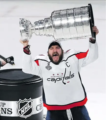  ?? ETHAN MILLER/GETTY IMAGES ?? Alex Ovechkin hoists the Stanley Cup Thursday night in Las Vegas after leading his Washington Capitals to a 4-3 victory over the Golden Knights in Game 5 of the Stanley Cup finals. Ovechkin was also named the Conn Smythe Trophy winner.