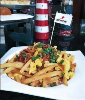  ?? PHOTO COURTESY OF ARAMARK ?? A creamy Gouda cheese sauce tops these Dutch loaded fries.