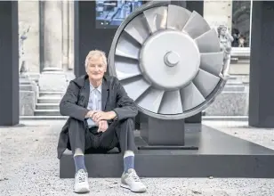  ?? AFP ?? Founder of the Dyson company, designer James Dyson, poses next to the model of an engine during a photo session at a hotel in Paris in 2018.