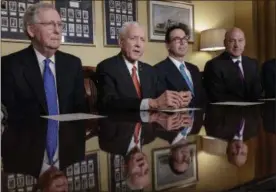  ?? J. SCOTT APPLEWHITE — THE ASSOCIATED PRESS ?? From left, Senate Majority Leader Mitch McConnell, R-Ky., Senate Finance Committee Chairman Orrin Hatch, R-Utah, Treasury Secretary Steven Mnuchin, and President Donald Trump’s economic adviser Gary Cohn, make statements to reporters as work gets...