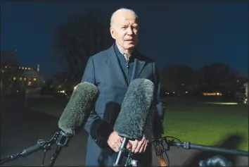  ?? ALEX BRANDON / ASSOCIATED PRESS ?? President Joe Biden answers a reporter’s question Dec. 20 as he walks from Marine One upon arrival on the South Lawn of the White House.