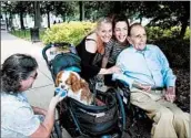  ?? CHERYL DIAZ MEYER/FOR THE WASHINGTON POST ?? Former Sen. Bob Dole, R-Kansas, takes a photo with visitors to the National World War II Memorial in Washington.