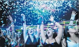  ??  ?? EDM FANS celebrate at the Cosmic Meadow stage at the festival on Friday.