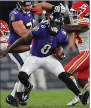  ?? (AP/Terrance Williams) ?? Baltimore Ravens quarterbac­k Lamar Jackson (8) runs the ball during the second half Sunday against the Kansas City Chiefs in Baltimore. Jackson had 107 of the Ravens’ 251 yards on the ground in a 36-35 victory.