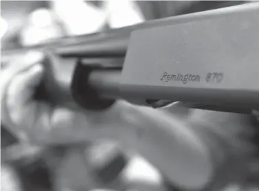  ?? Keith Srakocic/Associated Press ?? The Remington name is seen etched on a model 870 shotgun on March 1 at Duke’s Sport Shop in New Castle, Pa.