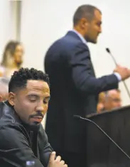  ?? Paul Chinn / The Chronicle ?? Andre Ward listens to upcoming opponent Sergey Kovalev at a news conference in April in Oakland.