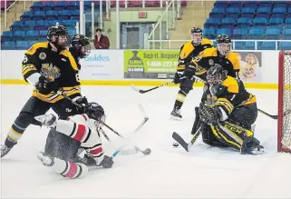  ?? JULIE JOCSAK THE ST. CATHARINES STANDARD ?? Goaltender Matt Onuska defends the Waterloo net against Niagara Falls’ Justin Randhawa Tuesday night. The Canucks travel to Waterloo Thursday night down 3-0 in their series against the Siskins.