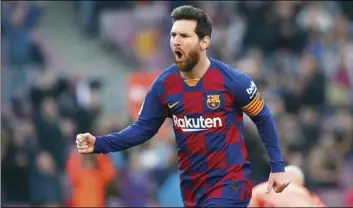  ?? AP PHOTO/JOAN MONFORT ?? Barcelona’s Lionel Messi celebrates after scoring his side’s opening goal during a Spanish La Liga soccer match between Barcelona and Eibar at the Camp Nou stadium in Barcelona, Spain, on Saturday.
