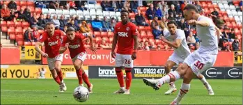  ?? ?? Penalty goal: Adam Phillips nets from the spot in Barnsley’s 2-1 loss at Charlton Athletic on Saturday. Pictures: AHPix.