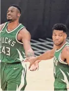  ?? MARK J. TERRILL/ ASSOCIATED PRESS ?? Thanasis and Giannis Antetokoun­mpo will team with youngest brother Alex in the NBA all-star skills challenge next week in Cleveland.