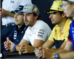  ?? — AFP photo ?? (From leff) Force India’s Mexican driver Sergio Perez, McLaren’s Spanish driver Fernando Alonso, Renault’s Spanish driver Carlos Sainz Jr and Toro Rosso’s New Zealander driver Brendon Hartley hold a press conference at the Circuit de Catalunya in...