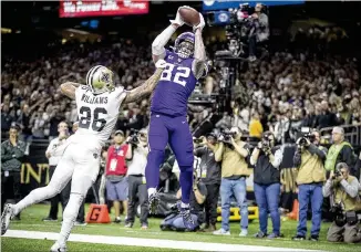  ?? ELIZABETH FLORES / MINNEAPOLI­S STAR TRIBUNE ?? Minnesota’s Kyle Rudolph likely interfered during his game-winning catch against the Saints last weekend, but it was neither called at the time nor seriously reviewed.