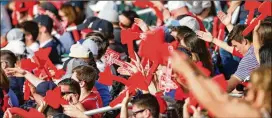  ?? ALYSSA POINTER/AJC FILE 2018 ?? Braves fans do the tomahawk chop during the 2018 season opener against the Phillies in Atlanta. By a 3-1 margin, fans say they like the tradition.
