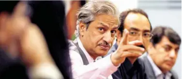 ?? Reuters ?? ↑
Absar Alam gestures during a planning meeting with senior staff in Islamabad.