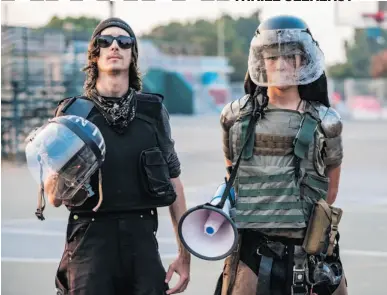  ?? NICK OTTO/THE WASHINGTON POST ?? John Cookenboo, left, and Vincent Yochelson are part of the antifa movement in California. The Bay Area natives began protesting against racism in 2009.