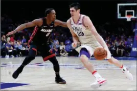  ?? CHRIS SZAGOLA — THE ASSOCIATED PRESS FILE ?? 76ers’ Ersan Ilyasova, right, drives against Heat’s Josh Richardson.