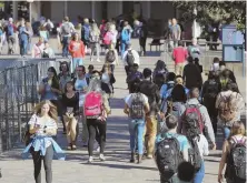  ?? TNS FILE PHOTO ?? HIT THE BOOKS: Students head to class at Western Washington University.