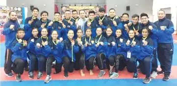  ??  ?? BETTER RESULTS:The state karate squad with Julian (centre, back) at the end of the 38th MAKAF National Senior Karate Championsh­ip in Kedah over the weekend.