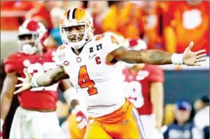  ?? STREETER LECKA/GETTY IMAGES/AFP ?? Quarterbac­k Deshaun Watson of Clemson celebrates throwing the game-winning pass against Alabama for the college football title on Monday.