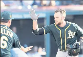  ?? TONY DEJAK – THE ASSOCIATED PRESS ?? A’s second baseman Jed Lowrie, right, said he got 14 tickets for family and friends to watch him in today’s All-Star Game in Washington D.C. Lowrie made the team as an injury replacemen­t.