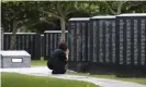  ?? Photograph: ïüînê^å·/AP ?? A woman prays in front of a monument to the Battle of Okinawa