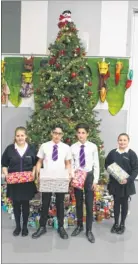  ??  ?? Ellie Beckett, Kai Dexter, Anton Dhanecha and Freya Shephard, of Cornwallis Academy, with the school’s donations