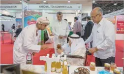  ??  ?? Visitors getting acquainted with the Omani products