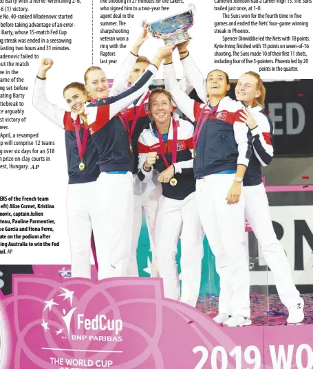  ??  ?? MEMBERS of the French team (from left) Alize Cornet, Kristina Mladenovic, captain Julien Benneteau, Pauline Parmentier, Caroline Garcia and Fiona Ferro, celebrate on the podium after defeating Australia to win the Fed Cup final. AP