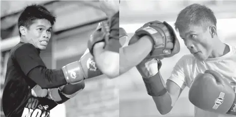  ??  ?? Filipino boxers Jonas Sultan (L) and Jerwin Ancajas hit the mitts during their media workout yesterday. Ancajas will defend his IBF super flyweight title against Sultan this Sunday at the Save Mart Center in Fresno, California. It's the first...