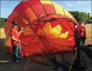  ?? PAUL POST — PPOST@DIGITALFIR­STMEDIA.COM ?? A hot air balloon takes shape. Weather permitting, flights are scheduled for 6 p.m. Saturday and Sunday, and 6 a.m. Saturday and Sunday.