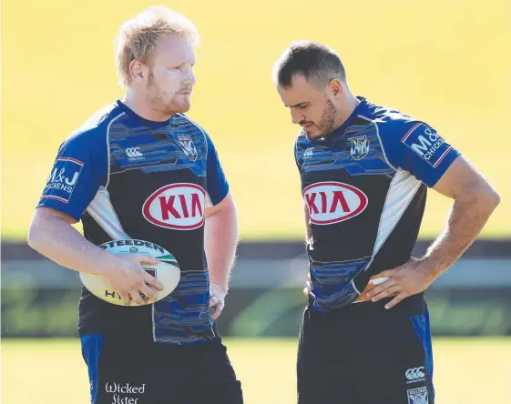  ??  ?? Josh Reynolds (right) in talks with Bulldogs skipper James Graham yesterday ahead of news the half was joining the Wests Tigers, Picture: BRETT COSTELLO