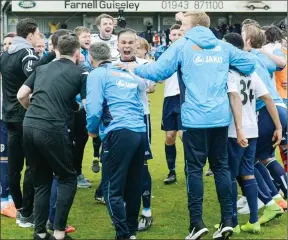  ?? PICTURE: Chris Hyslop ?? WE’VE DONE IT! Guiseley players celebrate in a huddle after news filters through of York City’s failure to beat Forest Green