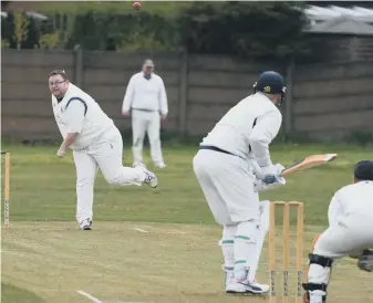  ??  ?? Silksworth’s Mark Foster, who took two Murton wickets in one over, bowls to Alan Wellburn on Saturday.