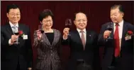  ?? PARKER ZHENG / CHINA DAILY ?? Chief Executive Carrie Lam Cheng Yuet-ngor, Wang Zhimin (center right), director of the Liaison Office of the Central People’s Government in the Hong Kong SAR, and Xie Feng (left), commission­er of the Ministry of Foreign Affairs in the HKSAR, propose a...