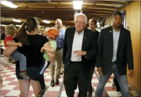  ?? AP PHOTO/MARY SCHWALM, FILE ?? FILE - In this Sept. 3, 2019, file photo, Democratic presidenti­al candidate Sen. Bernie Sanders, I-Vt., waves to potential supporters as he leaves a campaign event at the Circle 9 Ranch Campground Bingo Hall in Epsom, N.H. Sanders successful­ly turned his outsider credential­s and call for political revolution into a commanding victory in the 2016 New Hampshire primary. But as he seeks a repeat performanc­e, the Vermont senator could face unlikely competitio­n.