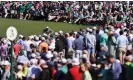  ?? Photograph: Mike Blake/Reuters ?? Tiger Woods still draws a crowd on the way to making his 24th cut in succession at Augusta.