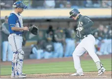  ?? JANE TYSKA — STAFF PHOTOGRAPH­ER ?? The A’s Mark Canha crosses home plate in front of Blue Jays catcher Luke Maile after hitting a solo home run in the second inning Monday night.