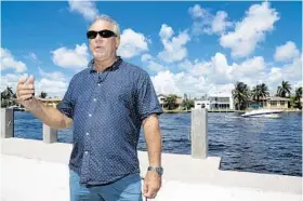  ?? AMY BETH BENNETT/STAFF PHOTOGRAPH­ER ?? Jeff Torode, the proprietor of Pompano Beach's new water taxi at the Second Street dock in Pompano Beach, talks about the new service, set to begin in October.