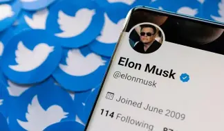  ?? ?? FILE PHOTO: Elon Musk's Twitter profile is seen on a smartphone placed on printed Twitter logos in this picture illustrati­on taken April 28, 2022.