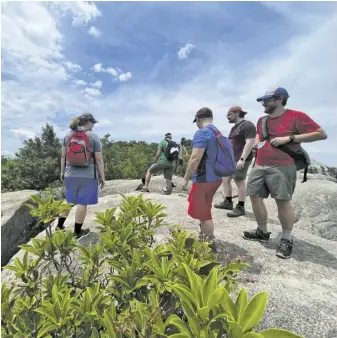  ?? FILE PHOTO COURTESY SHENANDOAH NATIONAL PARK ?? Hikers on Old Rag’s summit last summer.