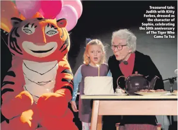  ??  ?? Treasured tale: Judith with Kitty Forbes, dressed asthe character of Sophie, celebratin­g the 50th anniversar­y of The Tiger WhoCame To Tea